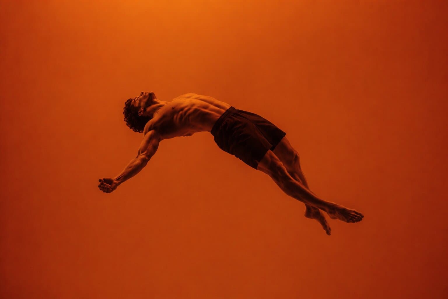 Athlete arched mid-air as if suspended